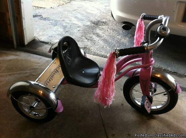 Pink Schwinn tricycle