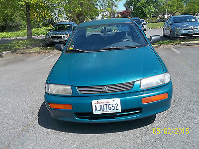 Mazda : Protege DX Sparkle green, excellent running condition, Automatic,  1.5 liter, 4-cylinder.