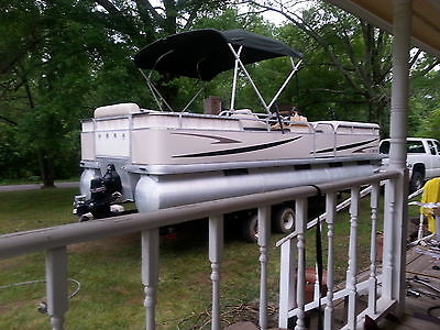 2001 MONARCK 24 FOOT PONTOON BOAT WITH A 3.0 INBOARD OUBOARD ENGINE AND TRAILER
