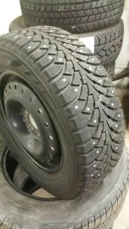 4 studded snow tires *good condition*, 1