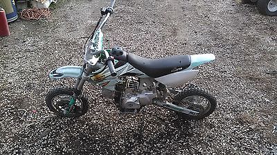 Other Makes : monster used off road motorcycle with kick or electric start. It is Gray And White.