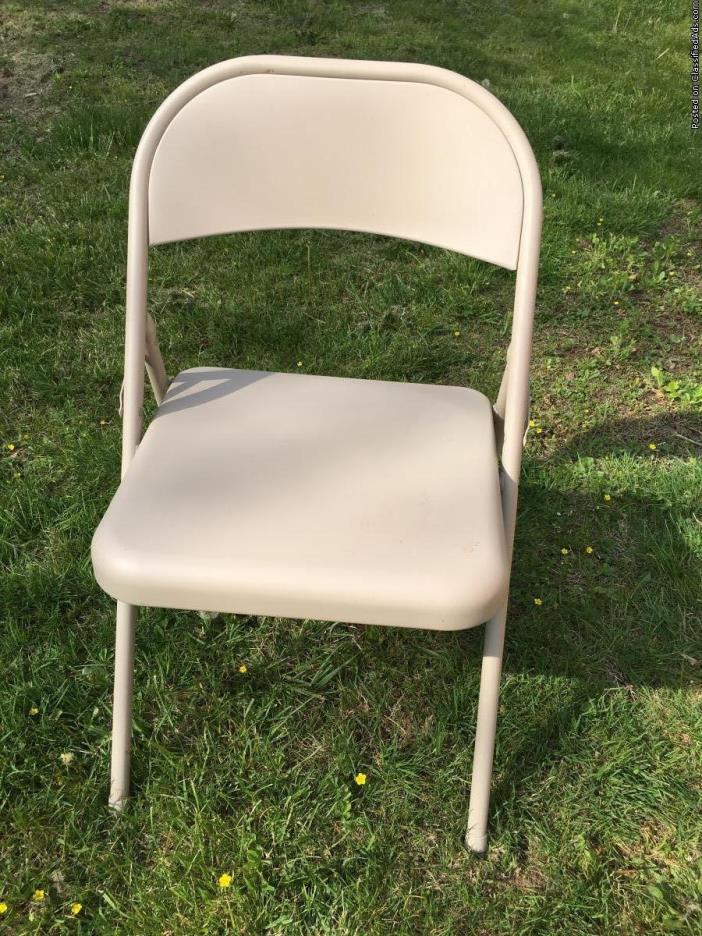 6 Tan metal folding chairs