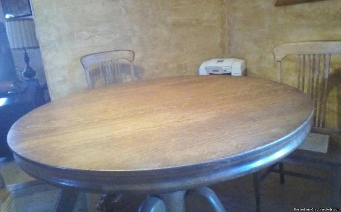 Solid oak table with claw feet, 1
