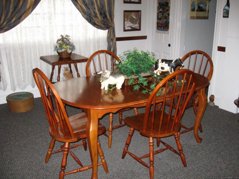 Cherry dining room table and 4 chairs.