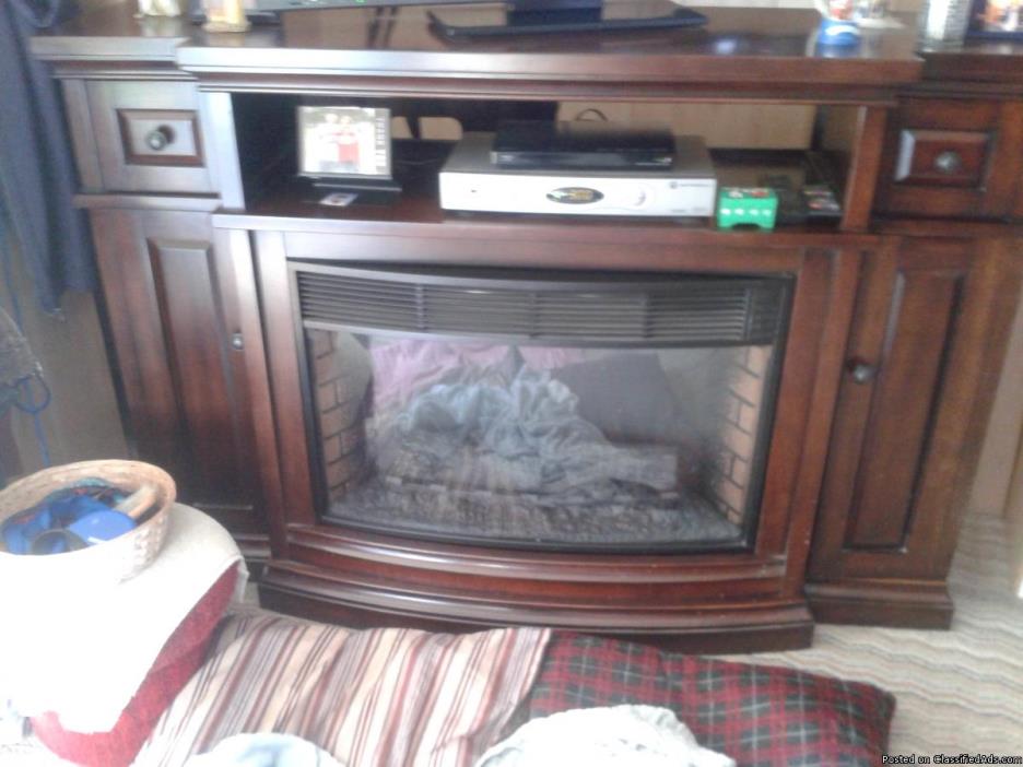Home theater stand w/infered heater with flame will hold 60 in. plus tv., 0