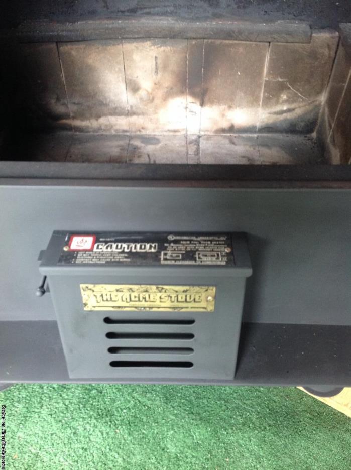 Wood stove that has built in water heating coils by  Acme for sale, 2