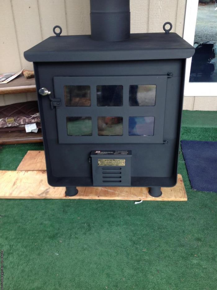 Wood stove that has built in water heating coils by  Acme for sale