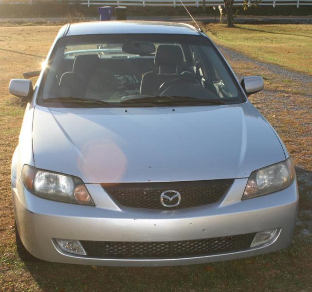 2003 ES Mazda Protege Silver 4 door 161,890 1 owner Cloth interior