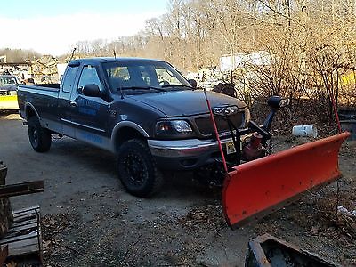 2002 Ford F-150  2002 Ford F150 XLT Extended cab 4x4 with 7' Western Unimount Snow Plow