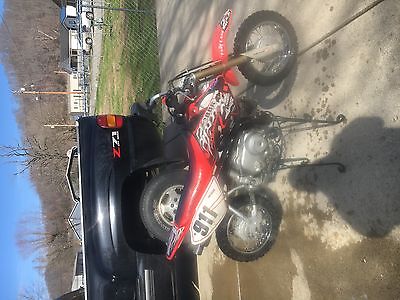 2005 Honda CRF  2005 honda crf50f motorcycle  with chest protector, and helment