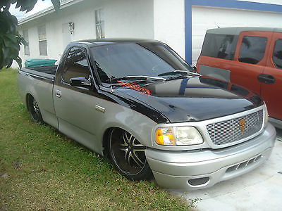 2002 Ford F-150  2002 BAGGED Ford F150 air ride lowrider mintruck sport truck black/silver suede