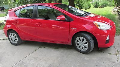 2013 Toyota Prius  2013 Toyota Prius C One 4dr Red Hatchback 4 Cylinder Automatic CVT  29853 miles