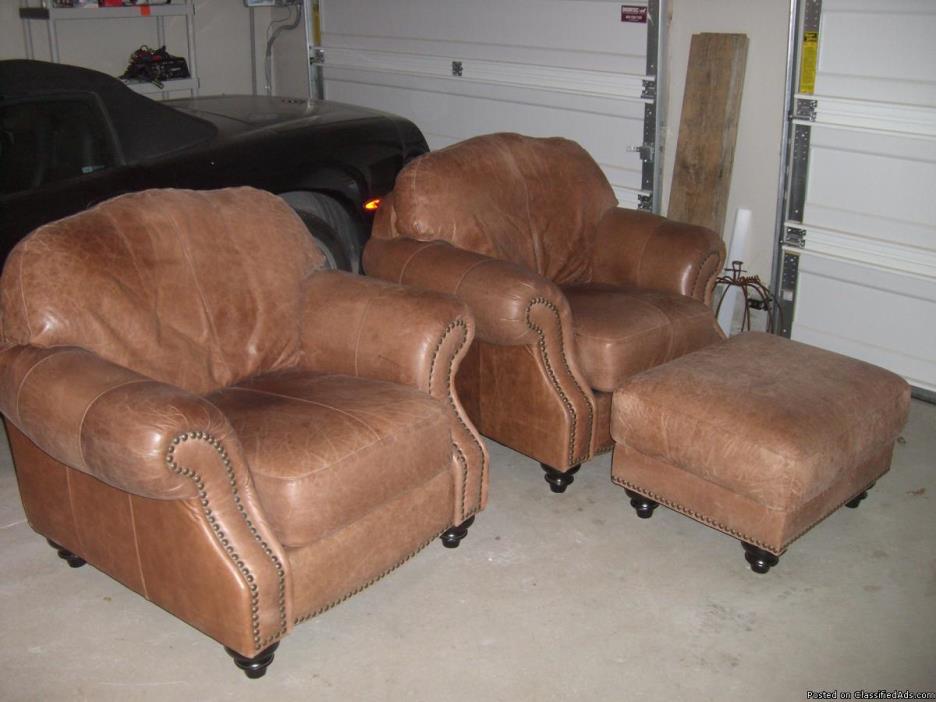 two leather chairs one ottoman, 0