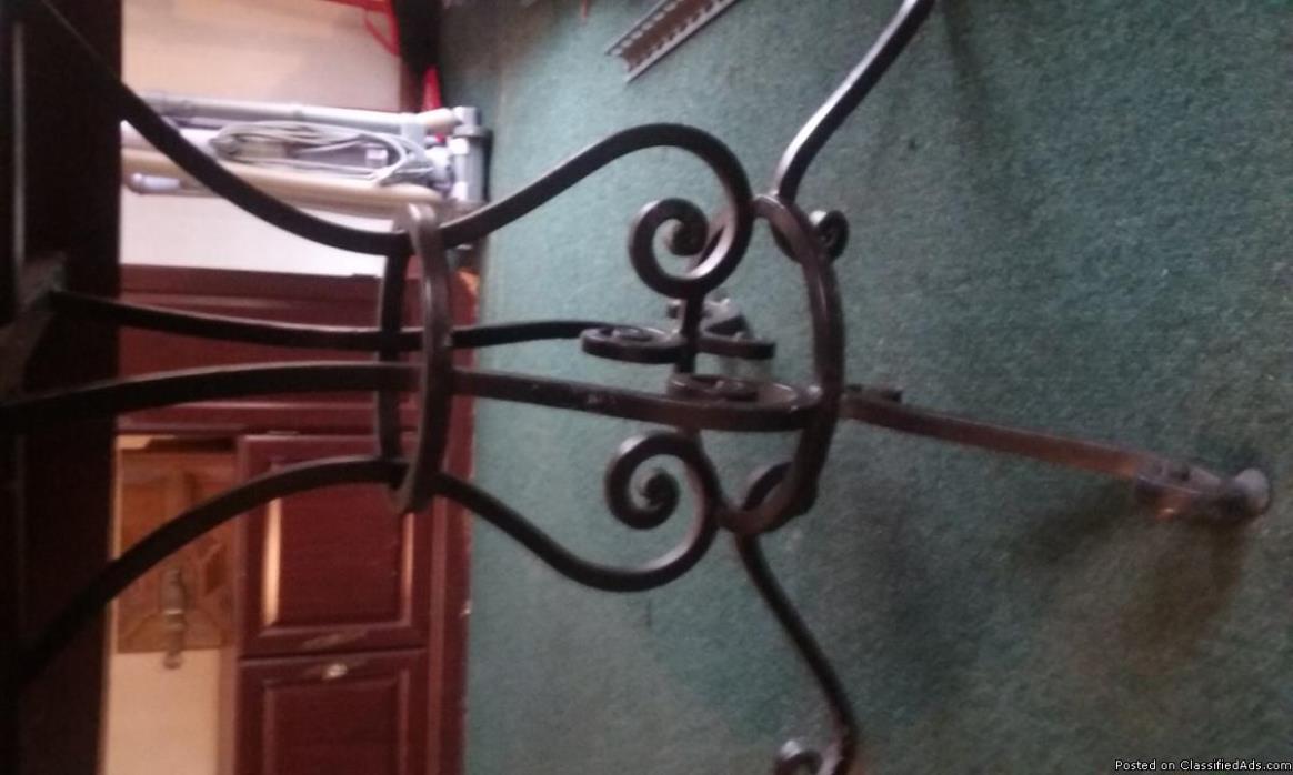 Mahogany kitchen table , 4 chairs,  Cast iron legs and arms , needs a good...