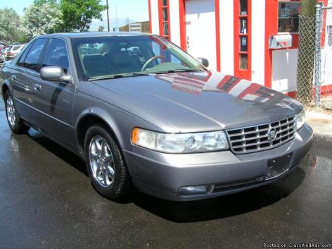 2055 THIS BIG SILVER IS WILL TAKE YOU FAR AWAY FOR SURE: 1999 CADILLAC SEVILLE...