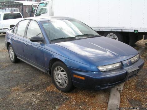 2226 YOULL WANNA DRIVE INTO THE SUNSET WITH THIS VEHICLE: 1999 SATURN SL2
