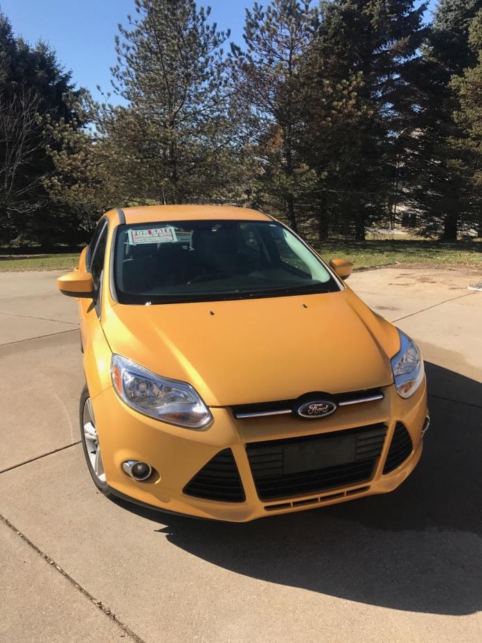 2012 Ford Focus SE 2012 Ford Focus SE, Yellow, 4-Door Sedan, FWD, Automatic, with winter tires.