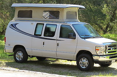 2013 Ford custom built camper van w/ 7k,  new interior and popup roof grt design