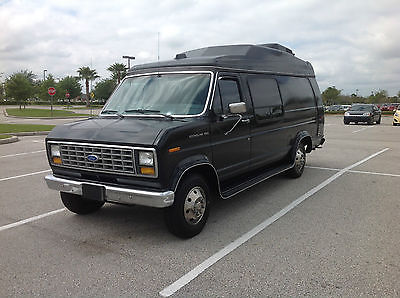Black Ford E 250 with wheelchair lift