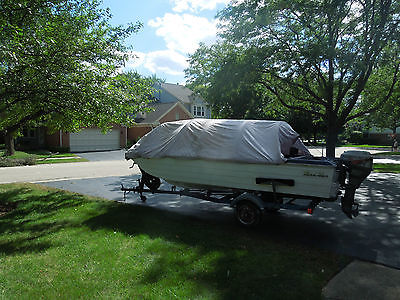 15 ft tri hull   fishing boat with 15 h.p. outboard motor and trailer