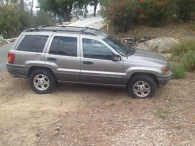 Jeep : Grand Cherokee Body trim Jeep Cherokee Laredo gray 4 door runs strong 140,000 miles damage to rear fender