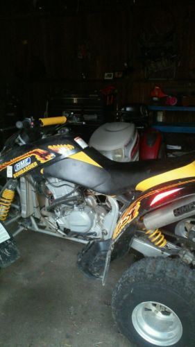 quad racer black and yellow bombardier ds 650