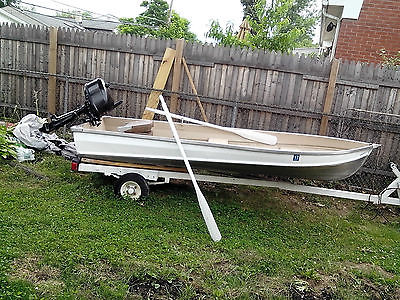 12 ft aluminum fishing boat with 6hp motor and trailer