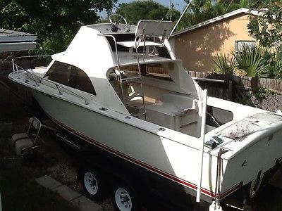 24' SPORT FISHING BOAT,W/FLYBRIDGE,BERTRAM LOOKING,DUEL AXEL ALUMINUM TRAILER