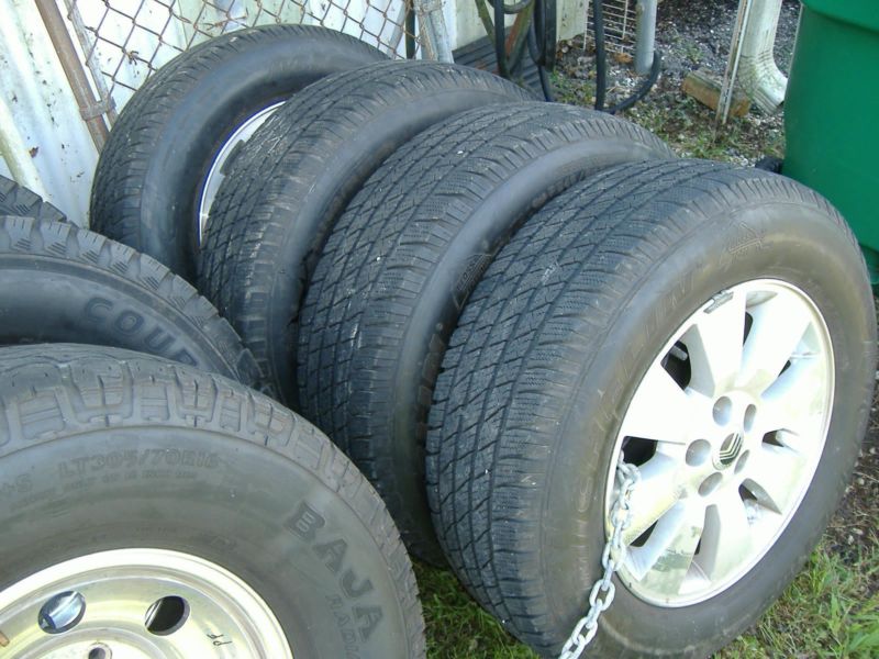 4 MERCURY TIRES AND RIMS