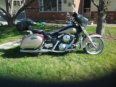 Kawasaki : Vulcan Two toned maroon and tan original paint scheme. Bagger, over the road bike.