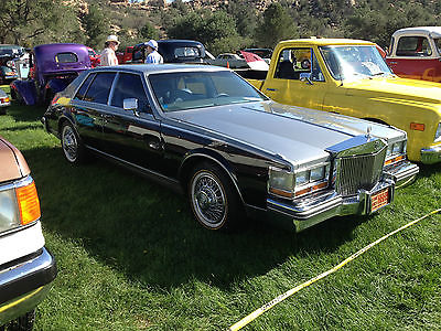 Cadillac : Seville Elegante This Black and Silver Paint is off 2004 cads with the small flakes grate cond.
