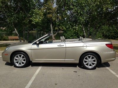 Chrysler : Sebring Touring Convertible top. Champagne body with black top. Grey interior.