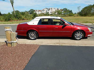 Cadillac : DTS DTS BRIGHT OPAL RED-  LIGHT TAN/ OFF WHITE TOP- LIGHT DRIFTWOOD INTERIOR