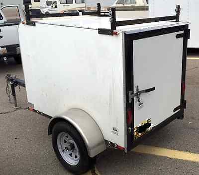 Trailer, covered, small, long tongue for use with slide-in-truck-camper.