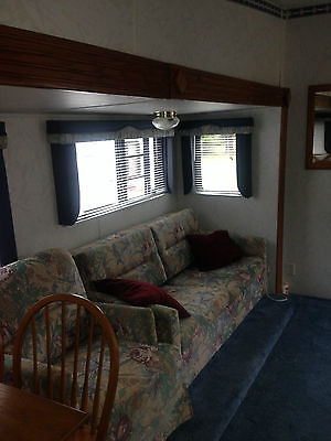 Used 98 Forrest River Sierra 5th wheel with slide out.