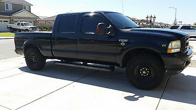 Ford : F-250 Solid Black with loud exhaust and Monster tires. Low Mileage. Great car