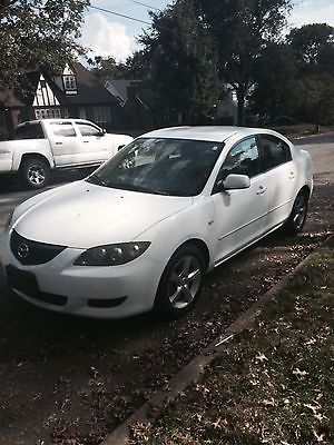 White, Mazda 3, 4 door sedan, automatic, 2004