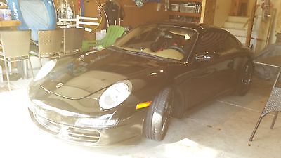 Porsche : 911 Carrera S Coupe 2-Door Black coupe with simpe, sensible track-oriented modifications (stock engine)