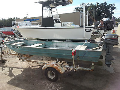 12 Ft Aluminum Johns boat with 6 hp Yamaha outboard and steel trailer