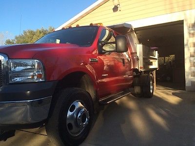 Ford : F-350 XLT cab and a half F-350 dually axle  8' x 9' stainless steel dump box with 9.2 hinkler v-plow