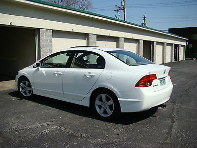 Honda : Civic EX White, four door, with five speed manual transmission.