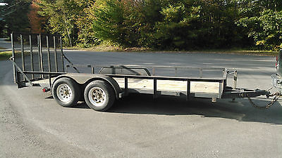 Landscape utility trailer with rear ramps