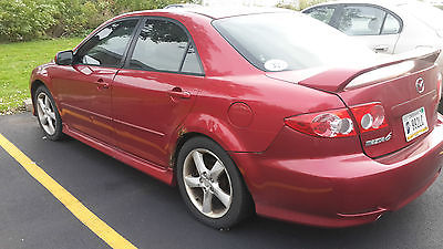 Mazda : MX-6 4DOORS engine good, color of body is red and its a sport